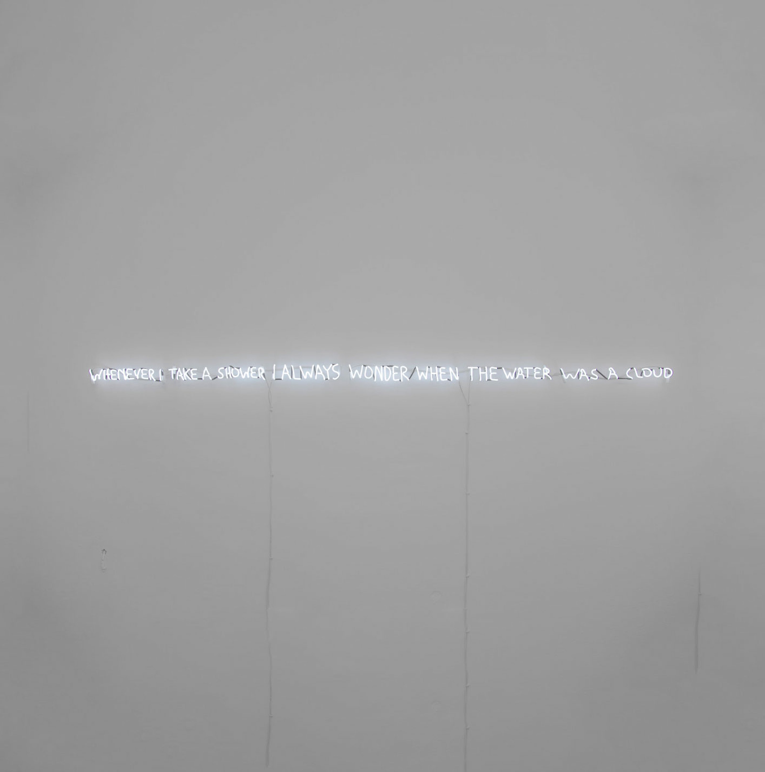 Written in neon: "Whenever I take a shower I always wonder when the water was a cloud" 