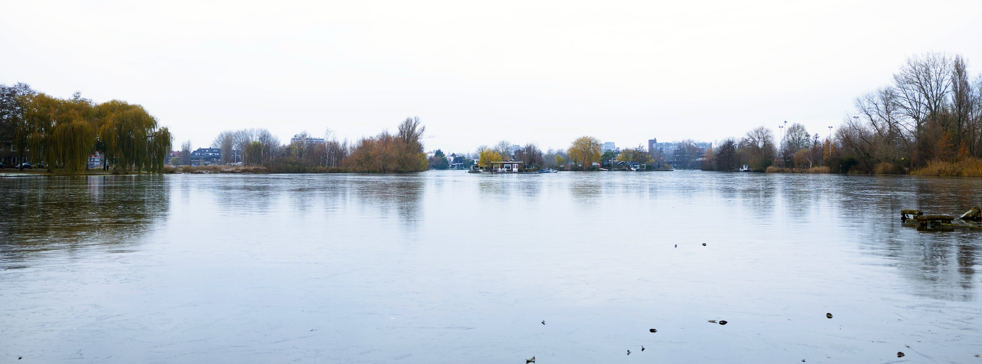 Wide angle view of the lake and the city in the distance.