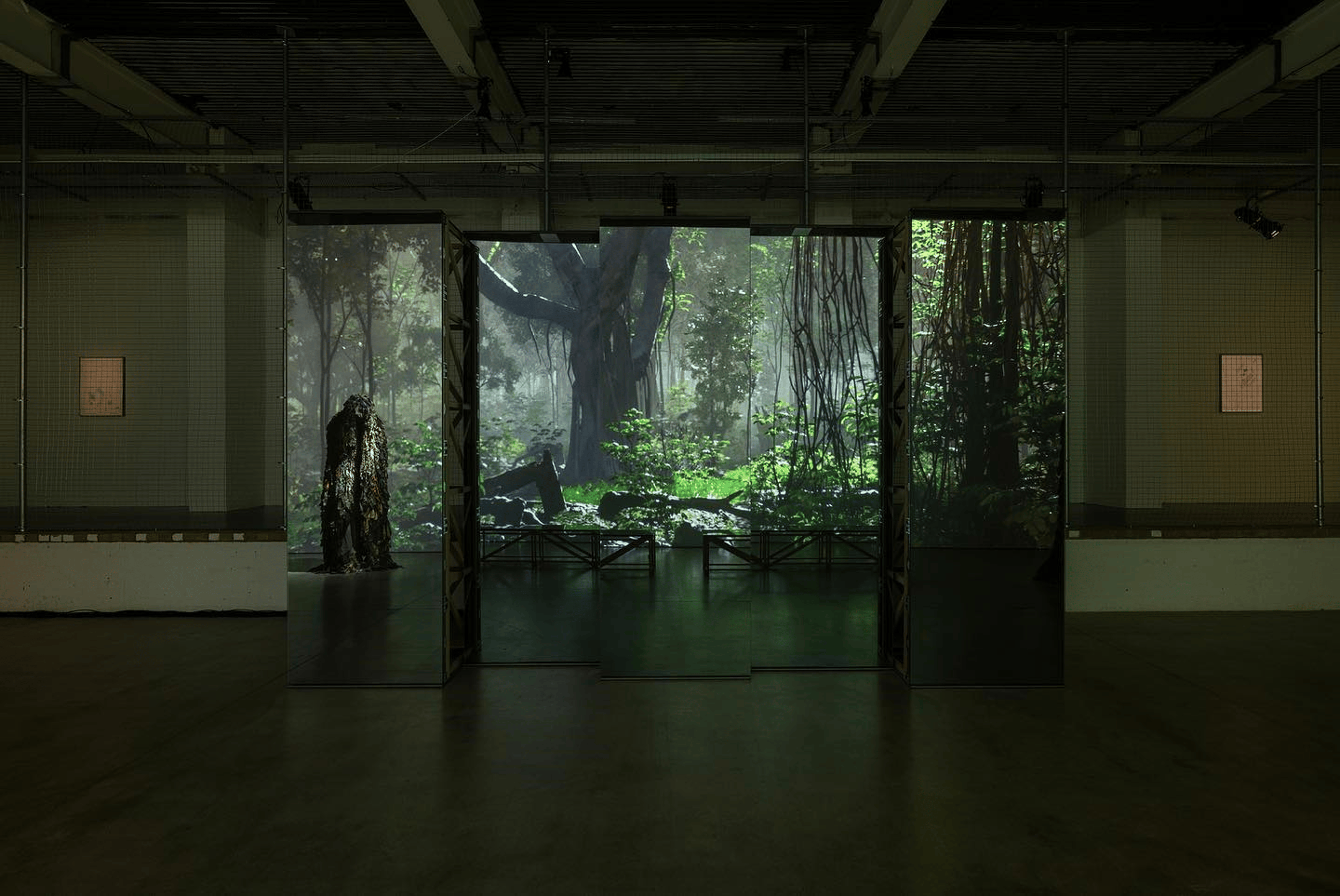 A screen reflected in an installation of cube-shaped full-length mirrors.