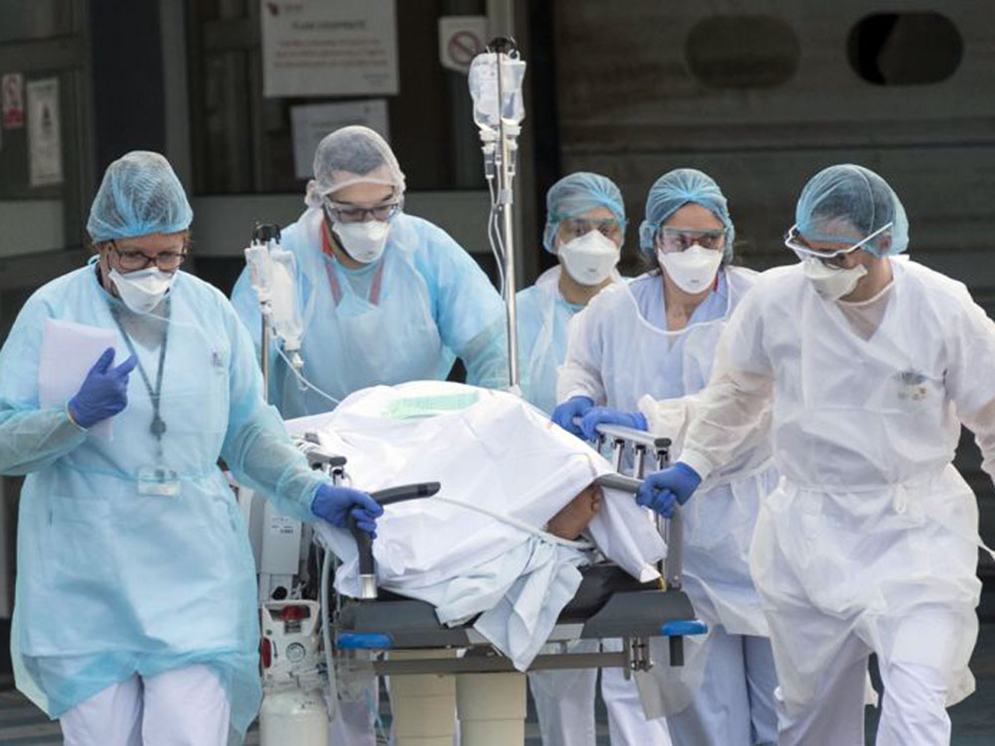 Healthcare professionals carrying a patient to the hospital