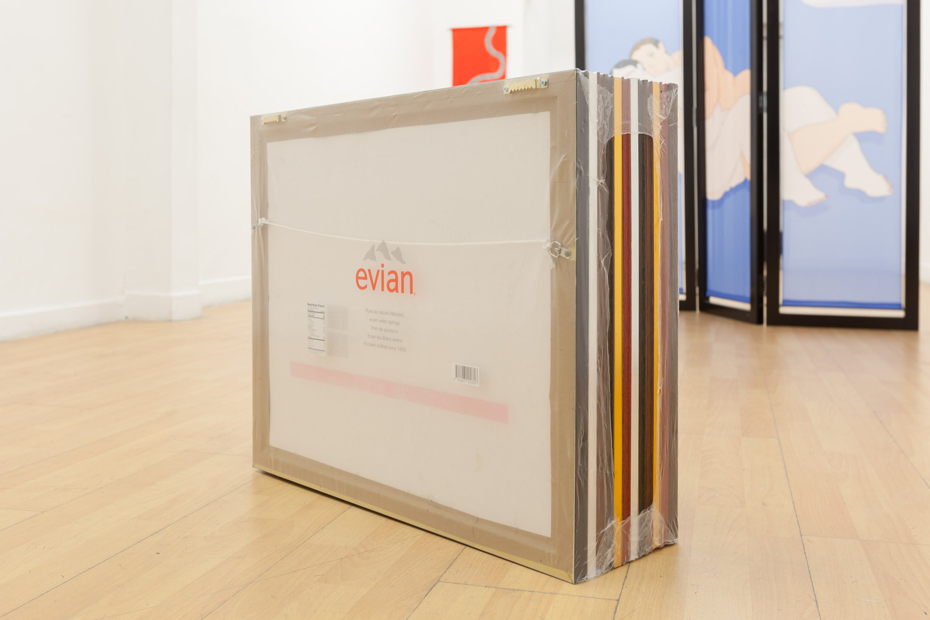12 frames wrapped in plastic, Evian logo on the plastic wrapper