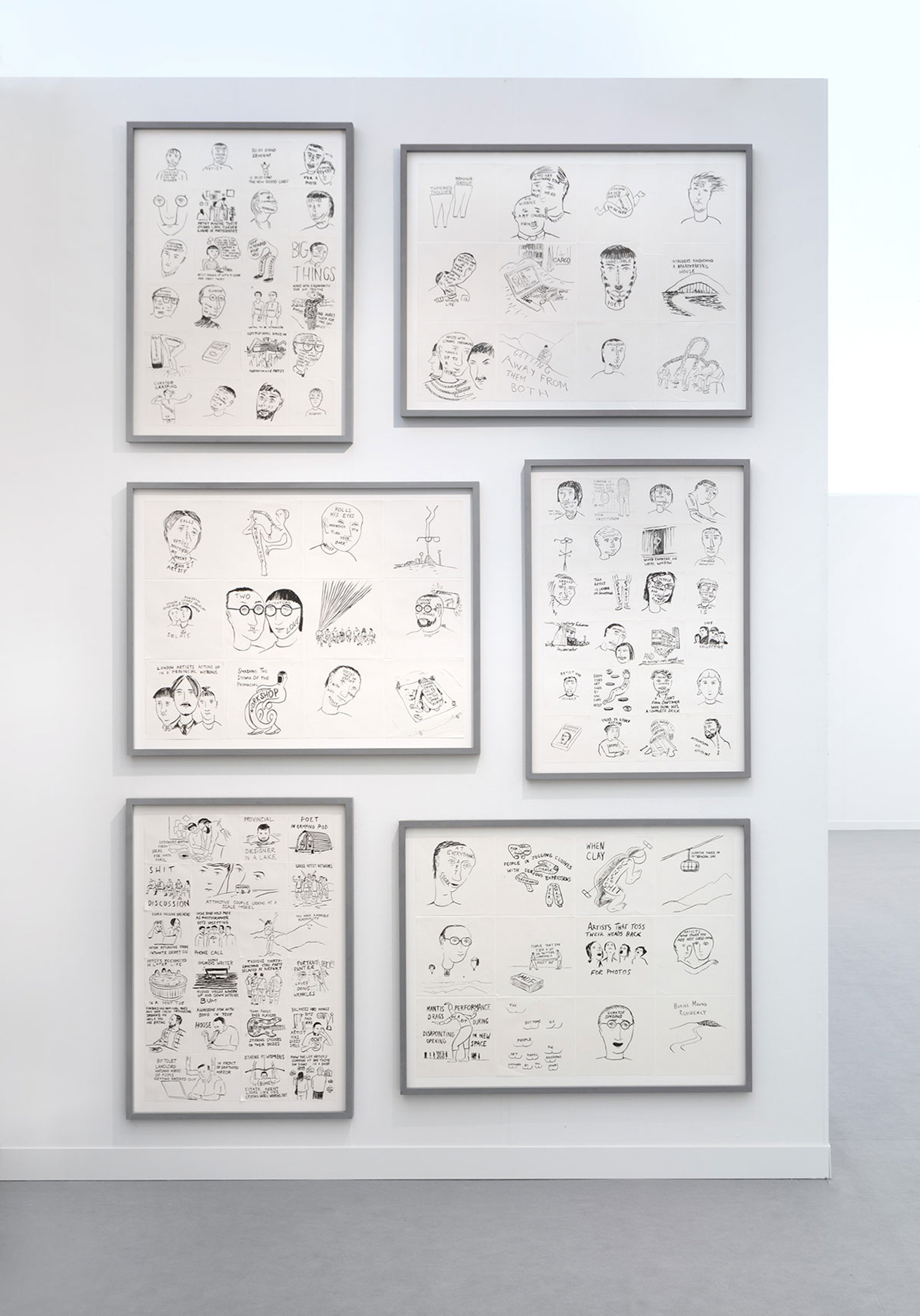 Six framed Bedwyr Williams drawings hanging on the wall at Frieze