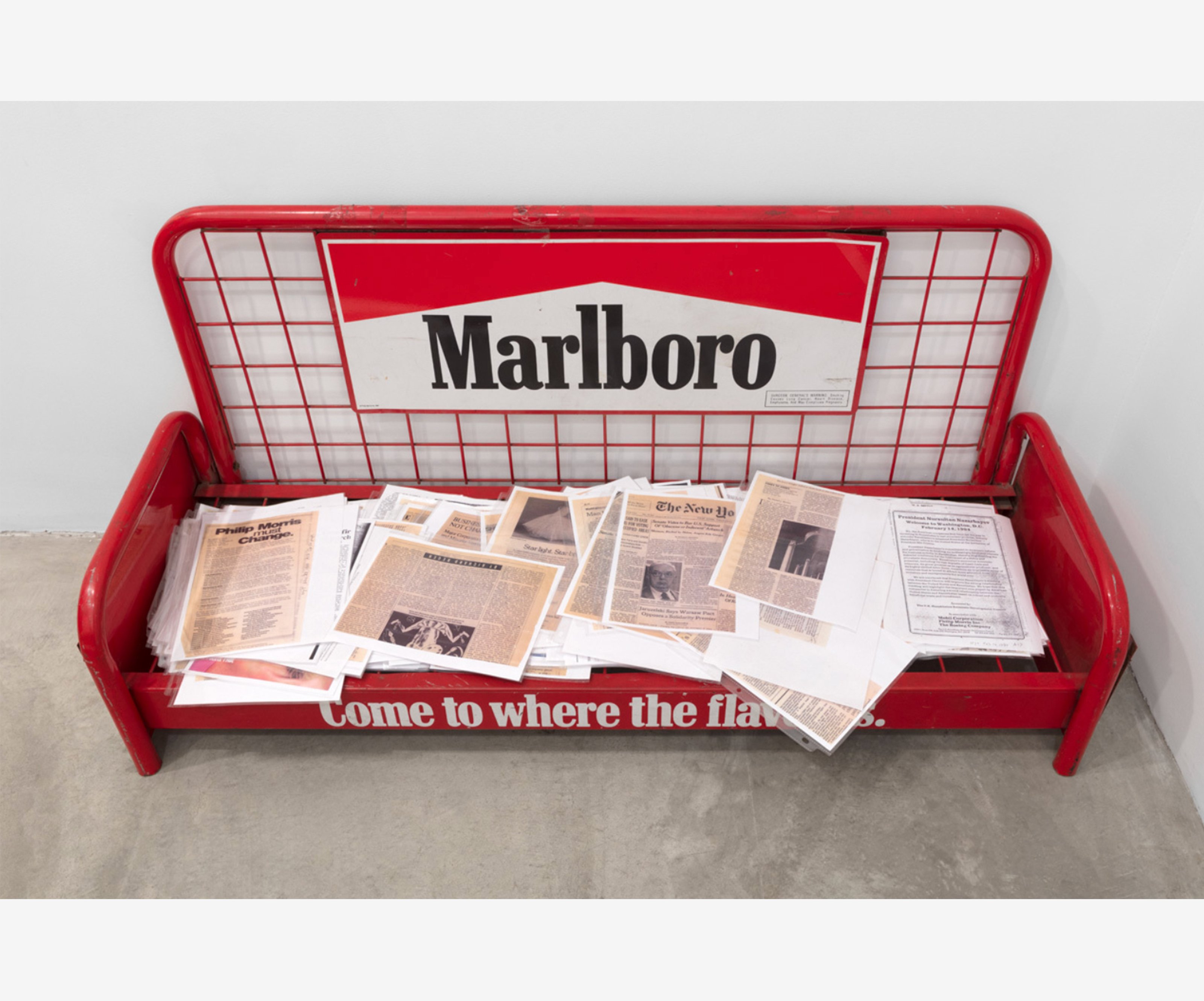 Marlboro bench with pamphlets spread out on it.