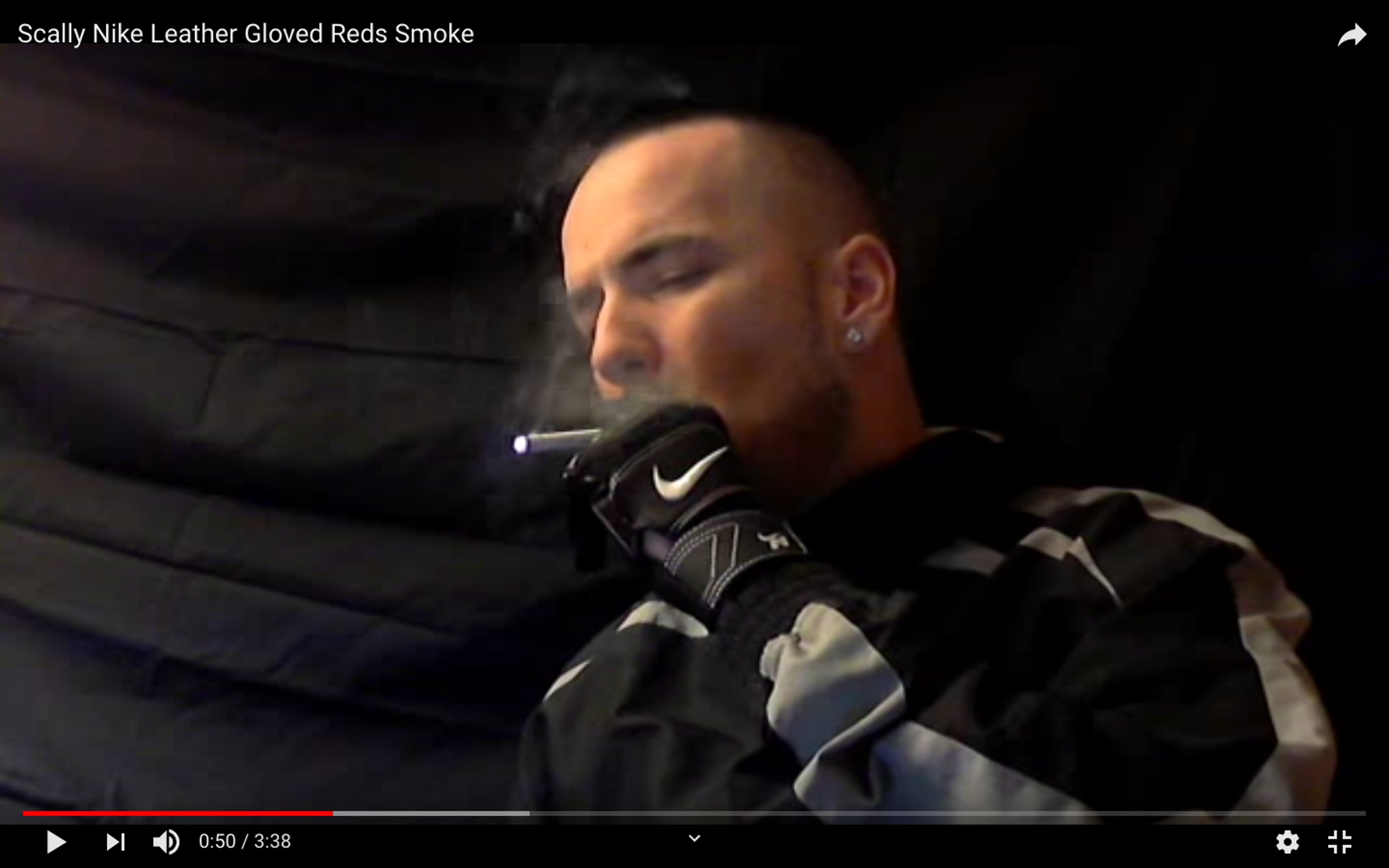 Youtube screenshot of CHAVSCUMBOSS smoking with Nike gloves on, in front of a black backdrop