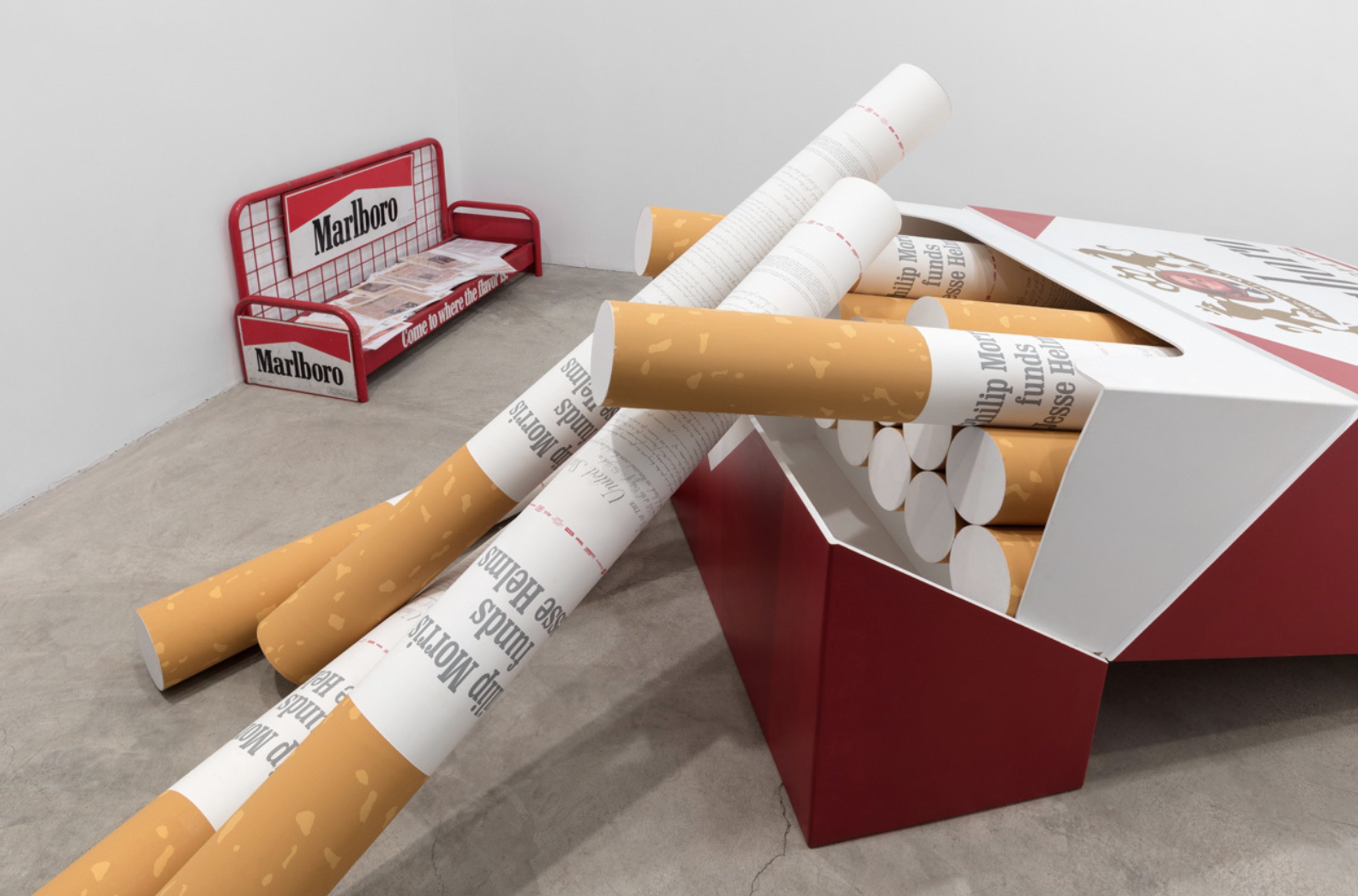 Cigarette pack and cigarettes, made to larger scale. On the cigarettes: 