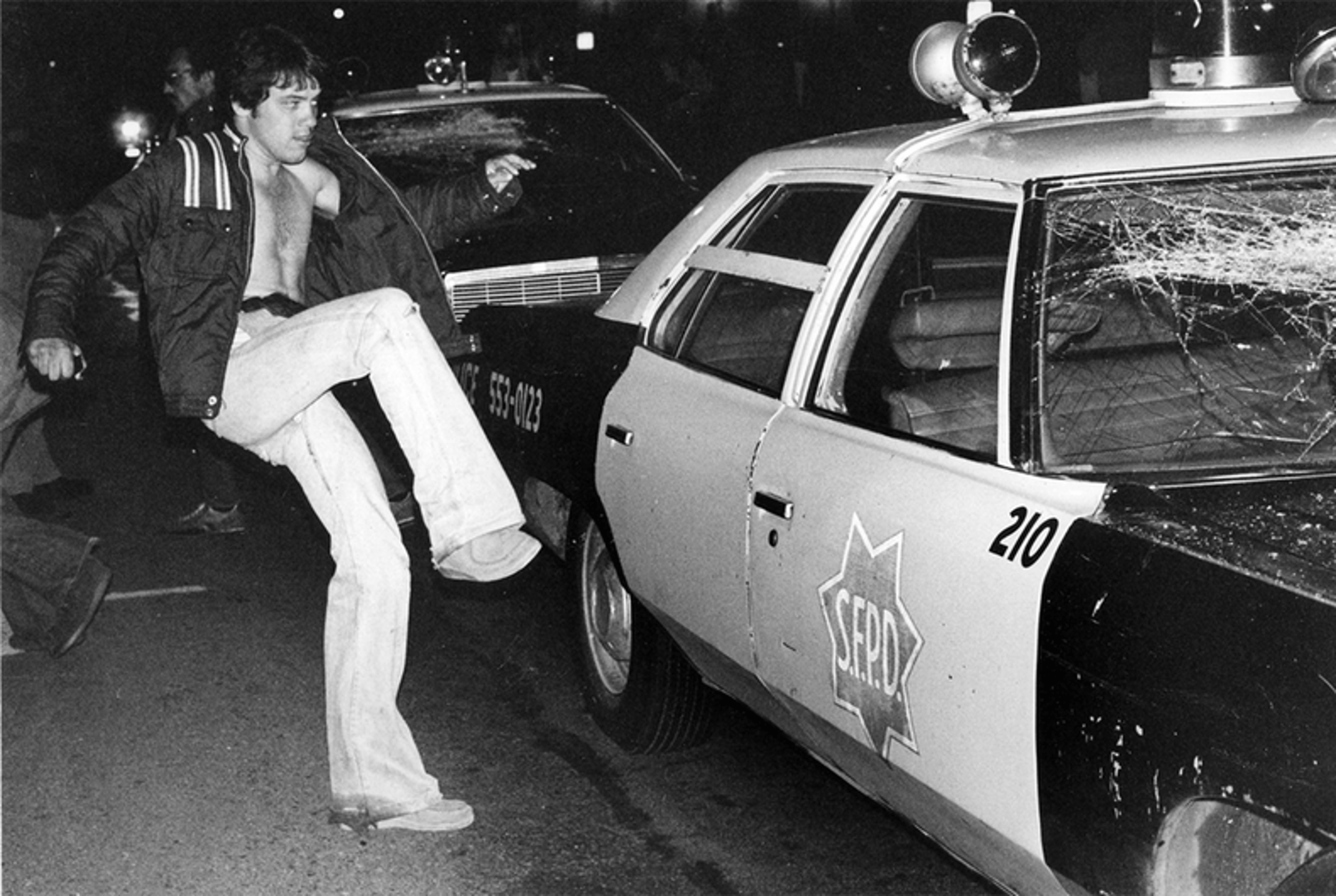 Protestor kicking police car, 1979