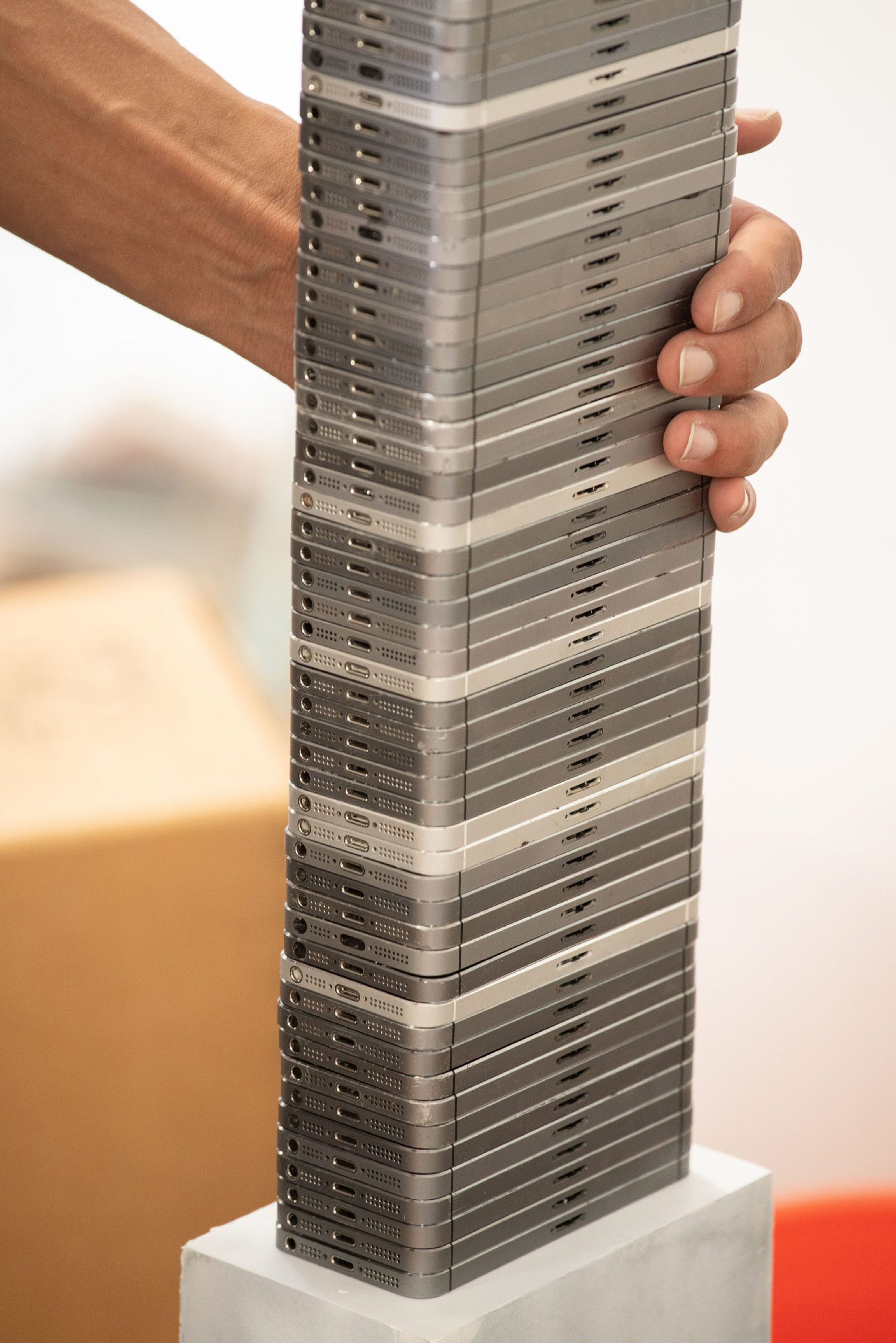 iPhones stacked on top of one another for American Artist's