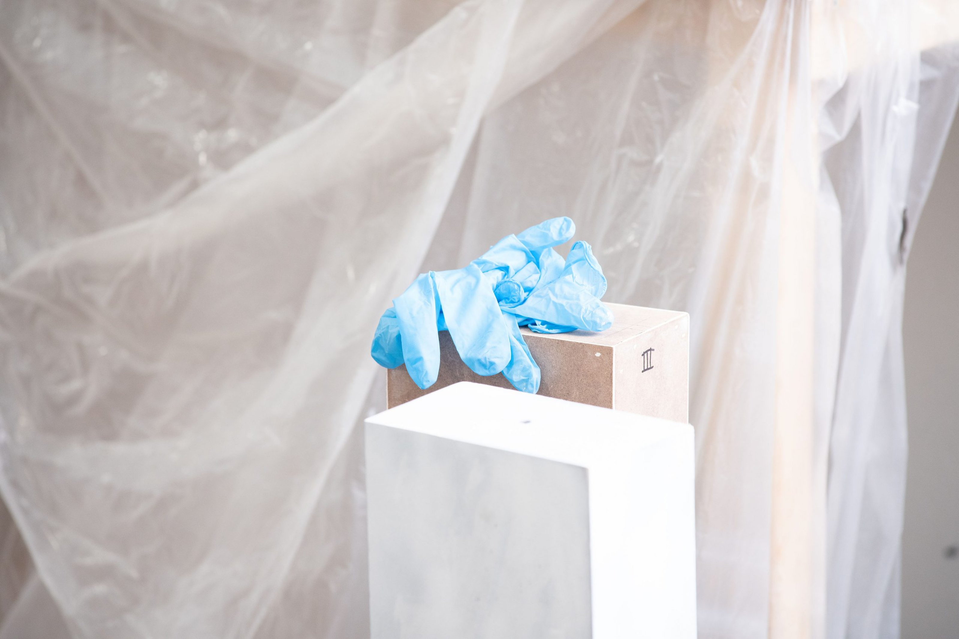 Blue plastic gloves left on a pedestal