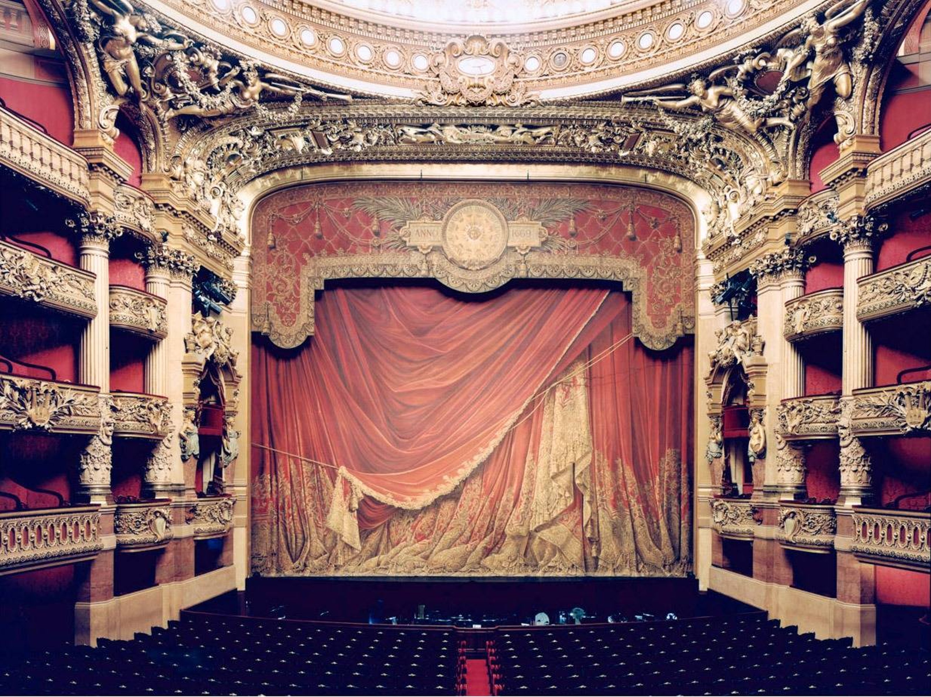 Candida Höfer's Opera Garnier Paris XXXI, 2005 is a photograph depicting a large empty opera hall