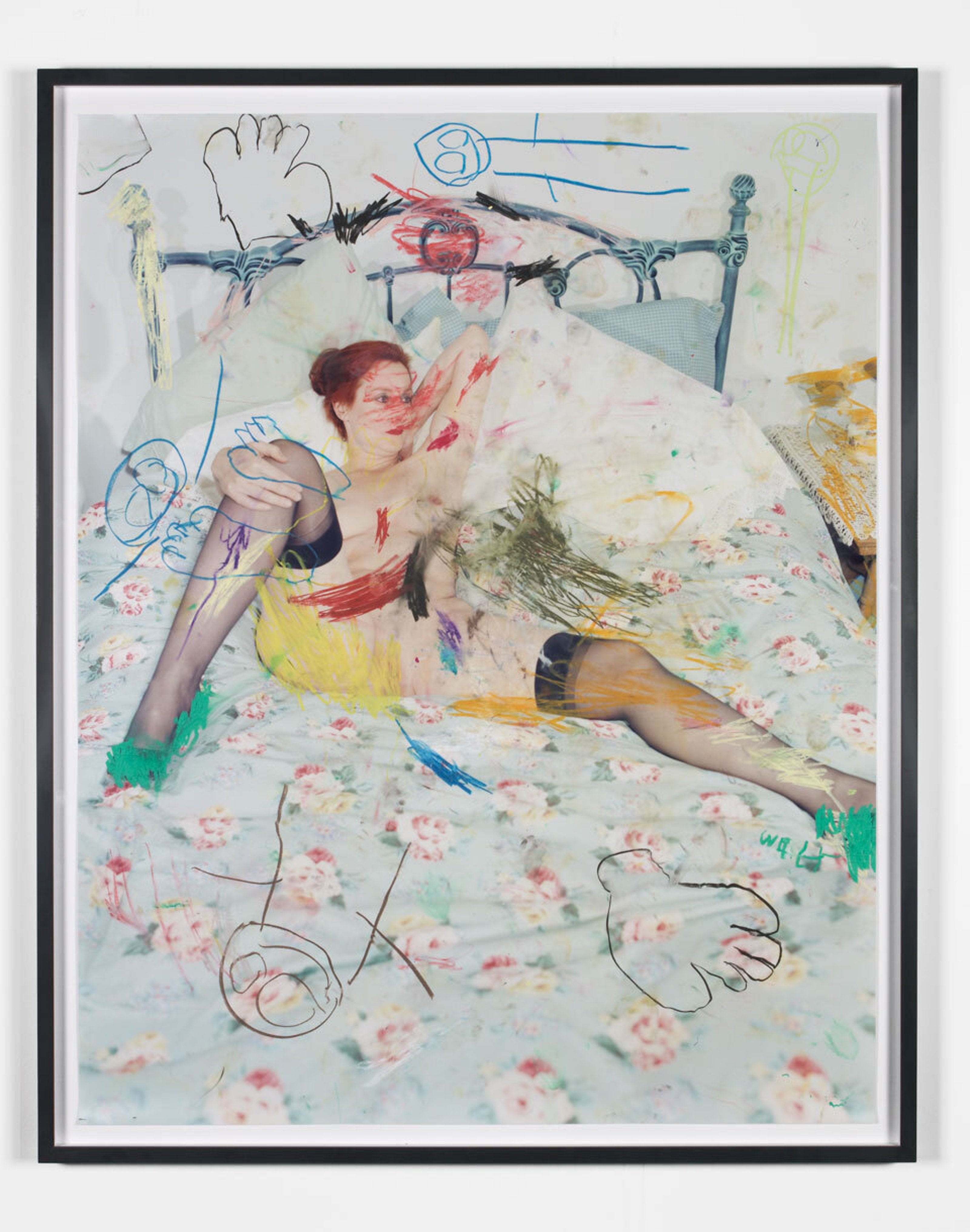 Photograph of a woman lying nude on a bed, with nondescript drawings on the image done in different colors of pastel paint