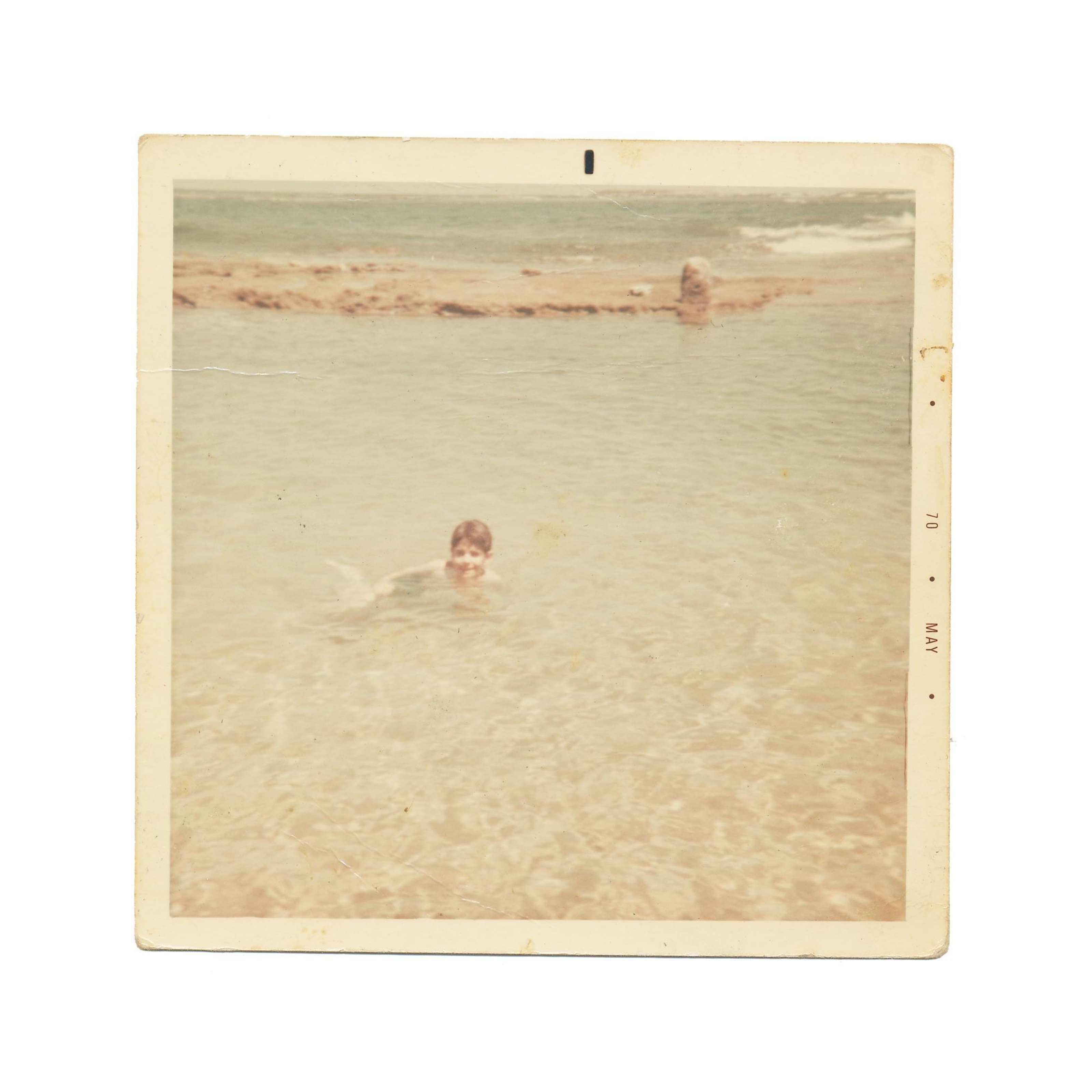 Félix González-Torres as a child, swimming in the sea.