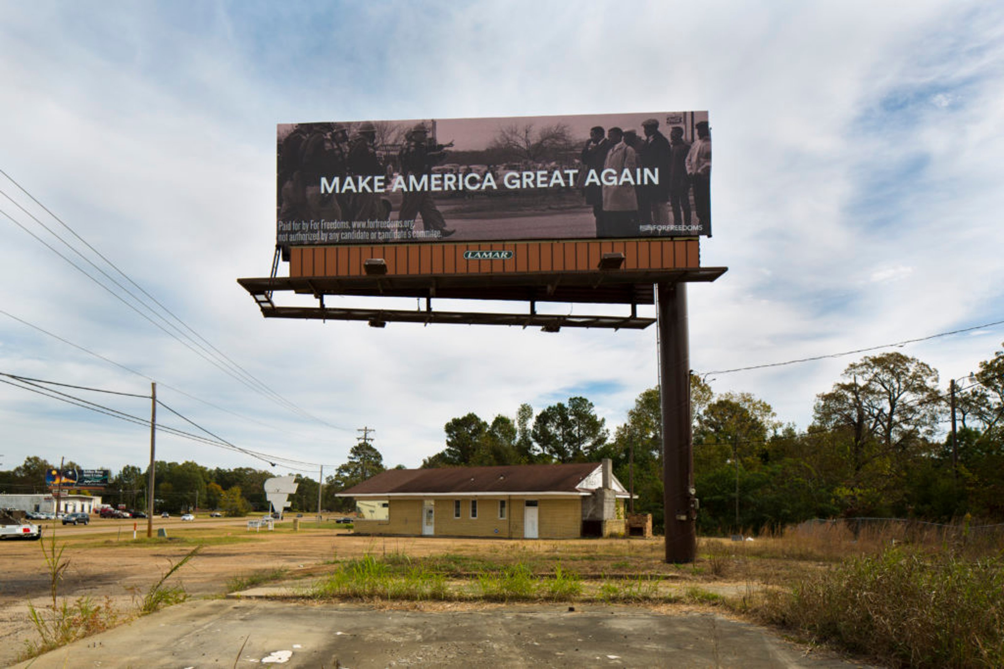 Artwork by Hank Willis Thomas showing a photo of a billboard that reads Make America Great Again