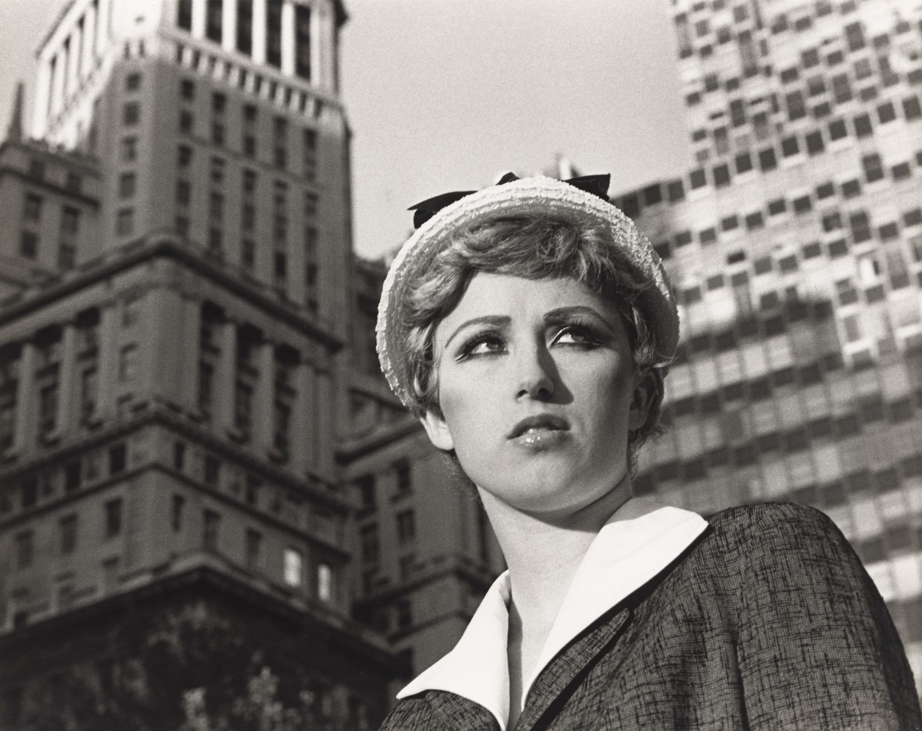 Image of Cindy Sherman dressed up nostalgically in a black and white photograph