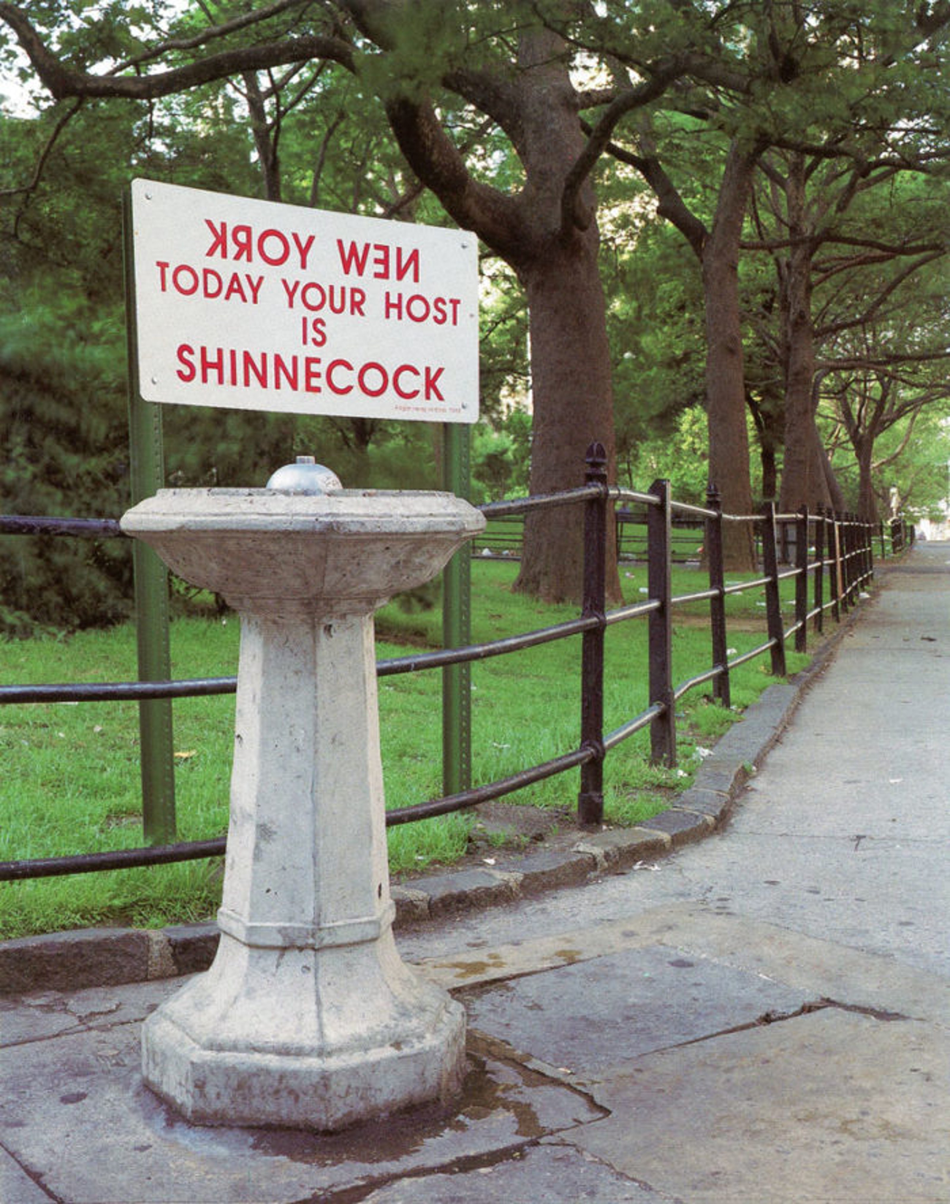On a sign installed on a fountain in the park: (written in inverse):