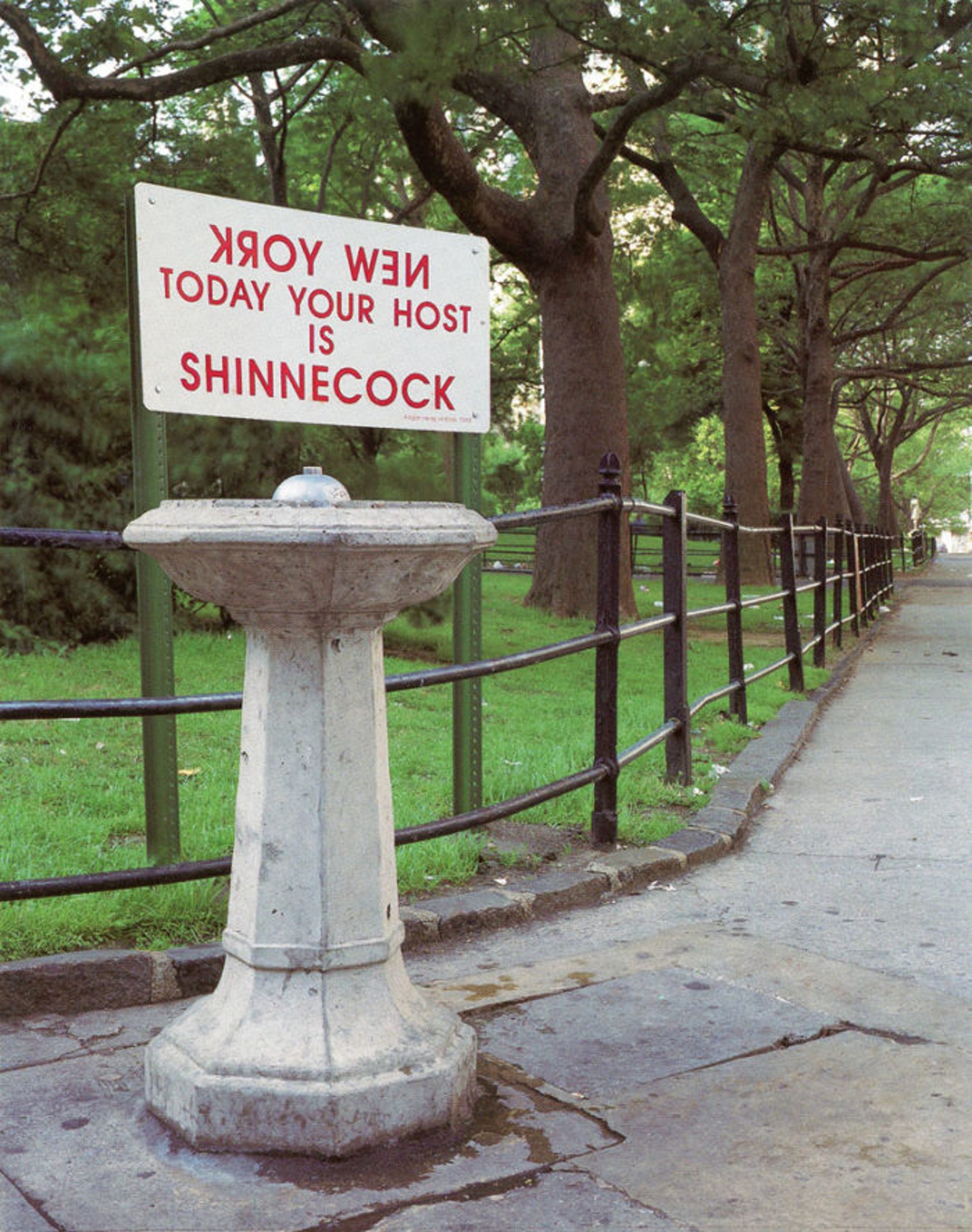 On a sign installed on a fountain in the park: (written in inverse): 